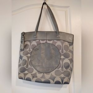 A Coach pre-owned shoulder bag.